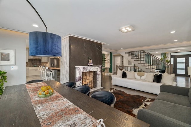 living room featuring a fireplace and ornamental molding