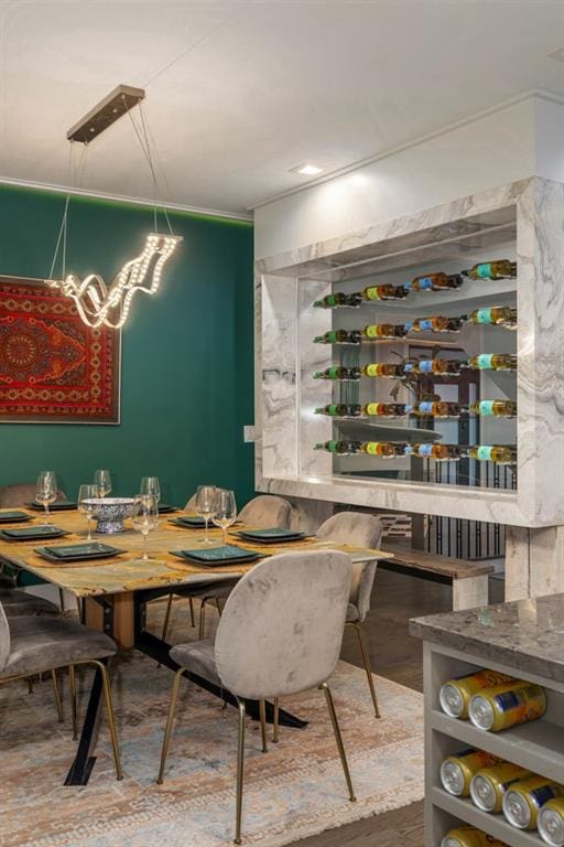 dining space with wood-type flooring