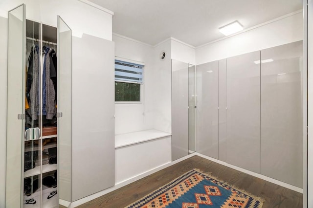 bathroom featuring hardwood / wood-style floors and ornamental molding