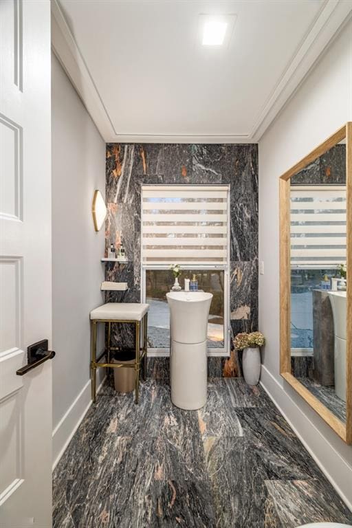 bathroom featuring crown molding