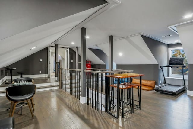 bar with hardwood / wood-style flooring and lofted ceiling