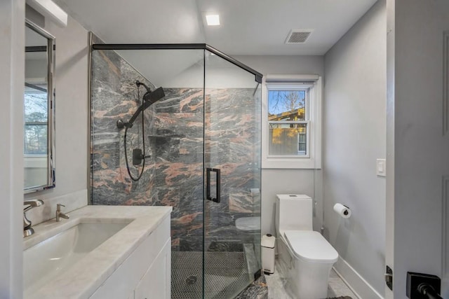 bathroom featuring vanity, an enclosed shower, and toilet