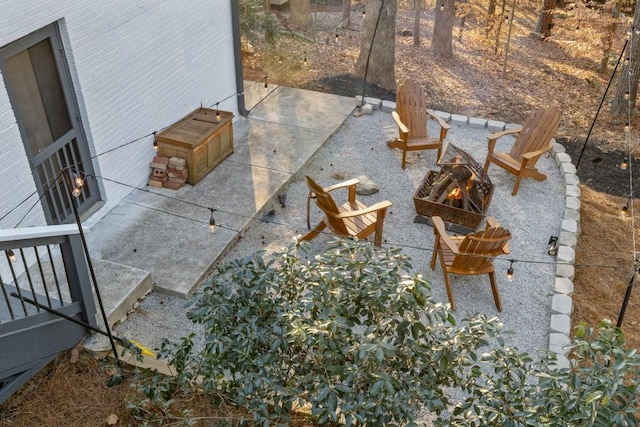 view of patio / terrace with an outdoor fire pit