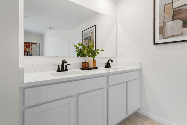 bathroom with vanity and tile patterned floors