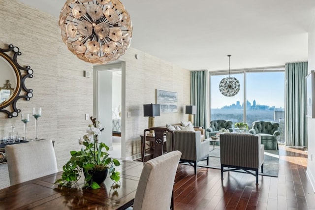 dining space with floor to ceiling windows, dark wood-type flooring, and a chandelier