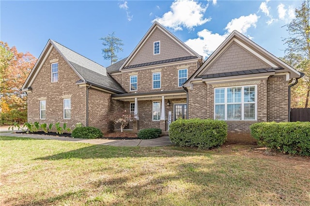 view of front of house with a front lawn and covered porch