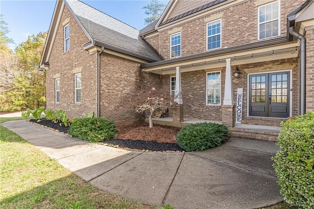 doorway to property featuring french doors and a porch