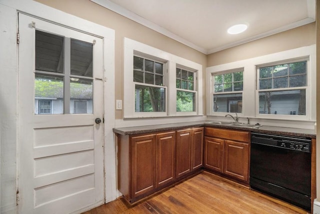 724 Bellemeade Ave NW, Atlanta, GA 30318 - kitchen featuring dishwasher, crown molding, light wood-type flooring, dark countertops, and brown cabinets