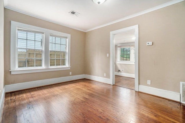 724 Bellemeade Ave NW, Atlanta, GA 30318 - unfurnished room featuring wood finished floors and ornamental molding