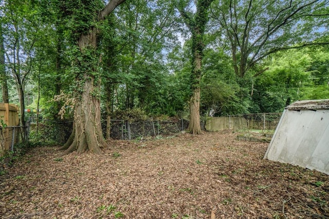724 Bellemeade Ave NW, Atlanta, GA 30318 - fenced backyard featuring a storage unit