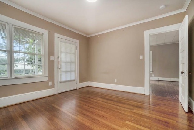 724 Bellemeade Ave NW, Atlanta, GA 30318 - unfurnished room with wood finished floors, ornamental molding, and a smoke detector