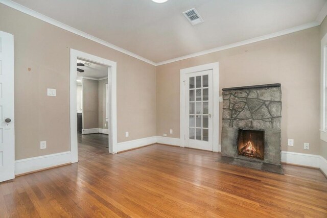 724 Bellemeade Ave NW, Atlanta, GA 30318 - unfurnished living room with wood finished floors, ornamental molding, and a fireplace