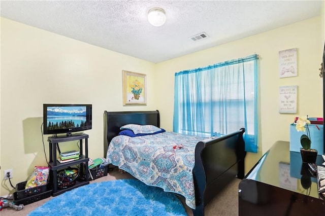 179 Parkside Dr, Stockbridge, GA 30281 - bedroom with carpet and a textured ceiling