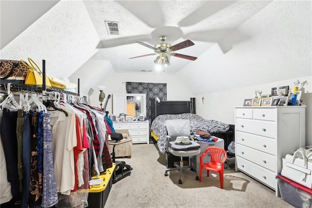 179 Parkside Dr, Stockbridge, GA 30281 - bedroom with carpet floors, lofted ceiling, a textured ceiling, and a ceiling fan