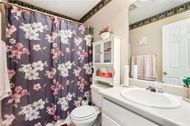179 Parkside Dr, Stockbridge, GA 30281 - full bathroom featuring a textured ceiling, vanity, and a shower with shower curtain