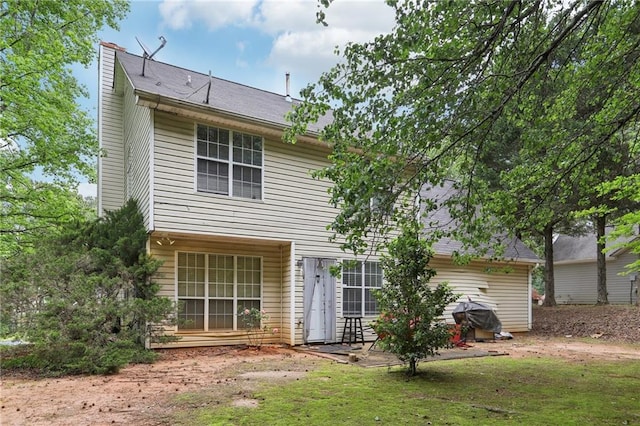 179 Parkside Dr, Stockbridge, GA 30281 - rear view of house featuring a chimney and a yard
