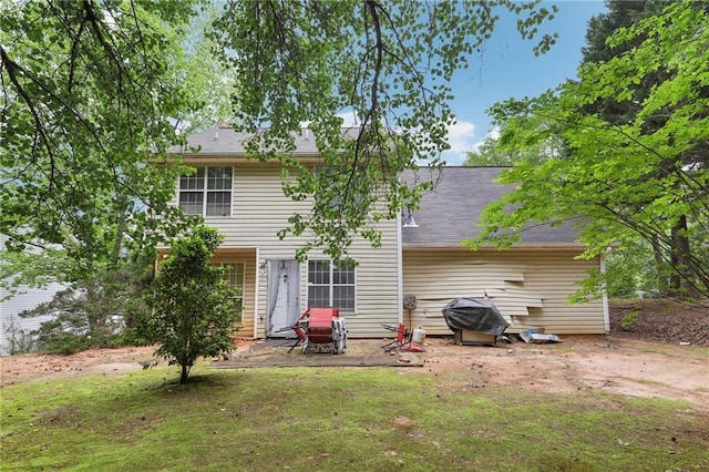 179 Parkside Dr, Stockbridge, GA 30281 - back of house featuring a patio and a lawn