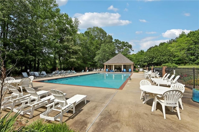 179 Parkside Dr, Stockbridge, GA 30281 - community pool with a patio area and view of wooded area