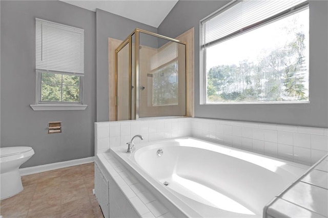 bathroom featuring lofted ceiling, tile patterned floors, toilet, and separate shower and tub