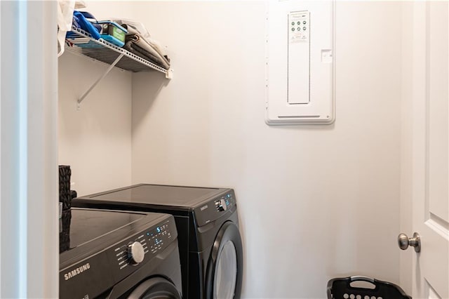 clothes washing area featuring washer and dryer