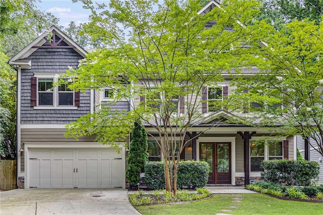 2544 Thompson Rd NE, Brookhaven, GA 30319 - view of front of house with french doors, an attached garage, and driveway