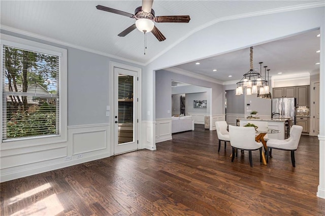 2544 Thompson Rd NE, Brookhaven, GA 30319 - dining room featuring wainscoting, ceiling fan, dark wood-style flooring, vaulted ceiling, and a chandelier
