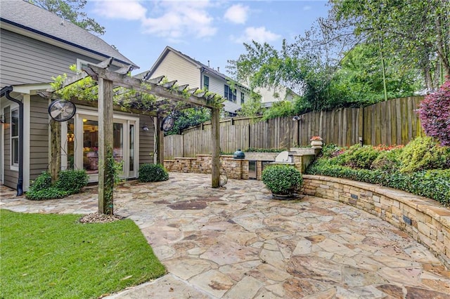 2544 Thompson Rd NE, Brookhaven, GA 30319 - fenced backyard featuring a pergola and a patio