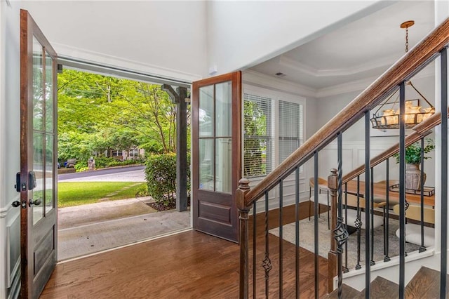 2544 Thompson Rd NE, Brookhaven, GA 30319 - entrance foyer featuring crown molding, french doors, wood finished floors, and stairway