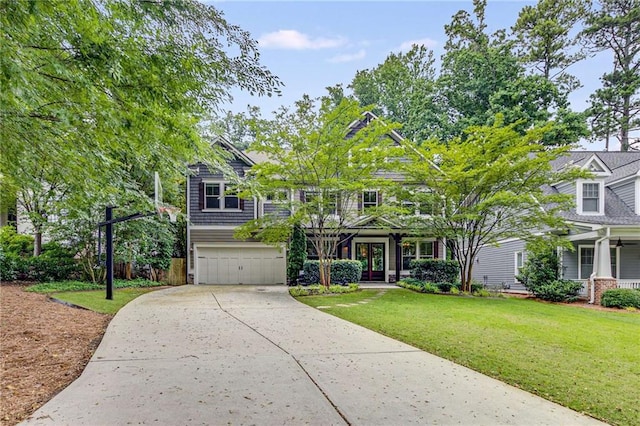 2544 Thompson Rd NE, Brookhaven, GA 30319 - view of front facade with a front yard, driveway, an attached garage, and french doors