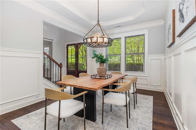 2544 Thompson Rd NE, Brookhaven, GA 30319 - dining space featuring a decorative wall, a chandelier, crown molding, stairway, and dark wood-type flooring