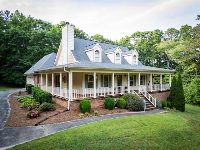 farmhouse with a porch and a front lawn