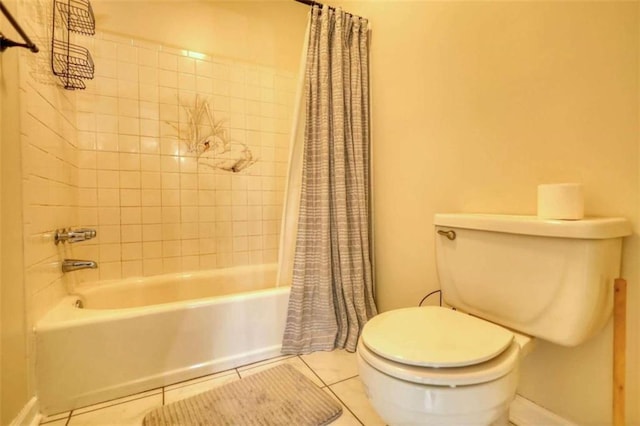 bathroom featuring tile patterned floors, toilet, and shower / tub combo