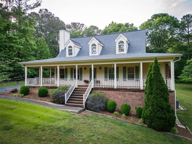 view of front of house with a front lawn and a porch