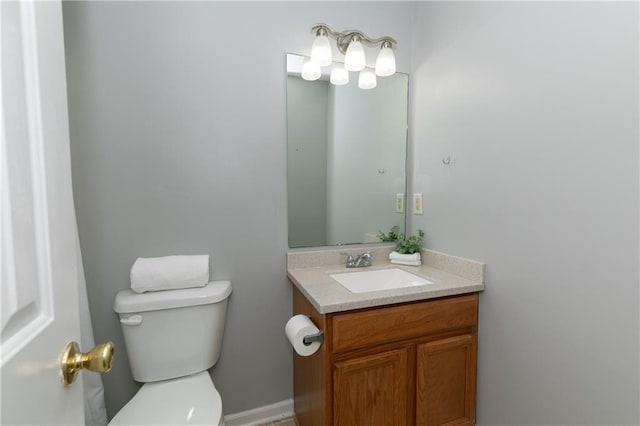 bathroom with toilet and vanity