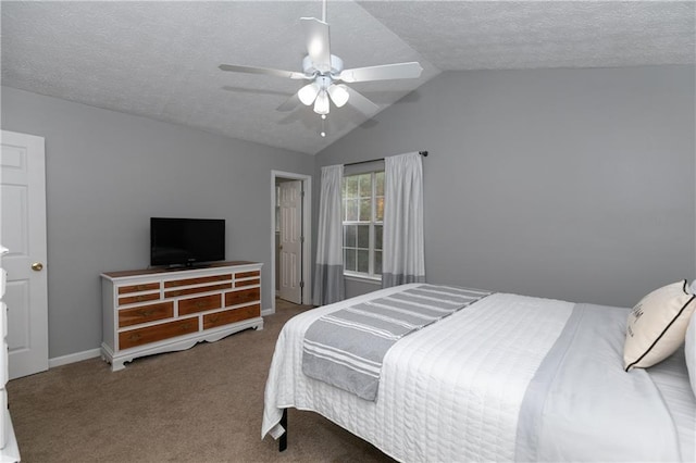 bedroom featuring carpet flooring, a textured ceiling, ceiling fan, and vaulted ceiling