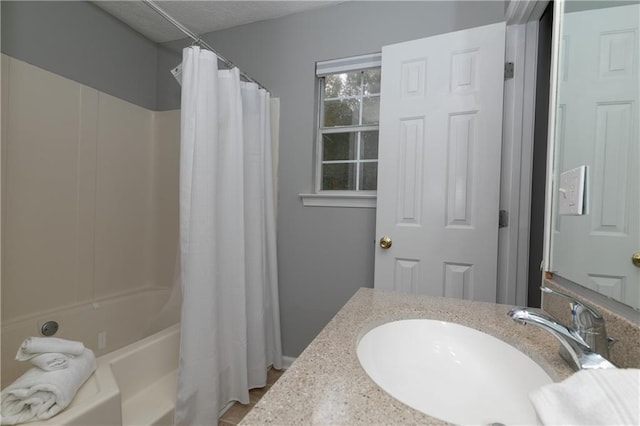 bathroom featuring vanity and shower / bath combo with shower curtain