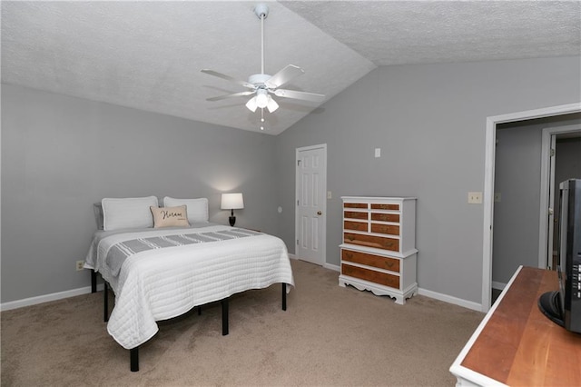 carpeted bedroom featuring lofted ceiling, a textured ceiling, and ceiling fan