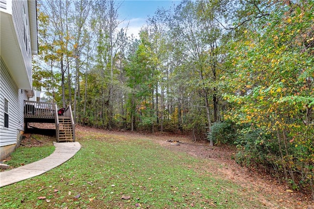 view of yard featuring a wooden deck