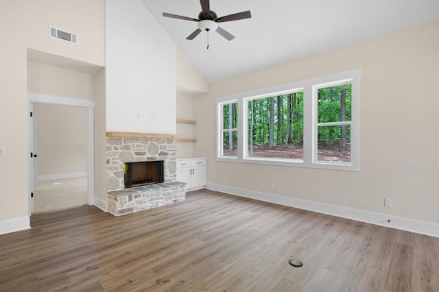 160 Doris Path, Dallas, GA 30157 - unfurnished living room featuring light wood-type flooring, baseboards, a ceiling fan, high vaulted ceiling, and a fireplace