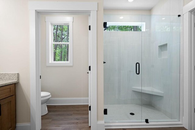 160 Doris Path, Dallas, GA 30157 - bathroom with vanity, toilet, a shower stall, and wood finished floors
