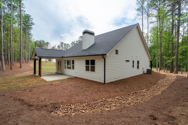 160 Doris Path, Dallas, GA 30157 - rear view of house featuring a patio, a chimney, a shingled roof, and central air condition unit