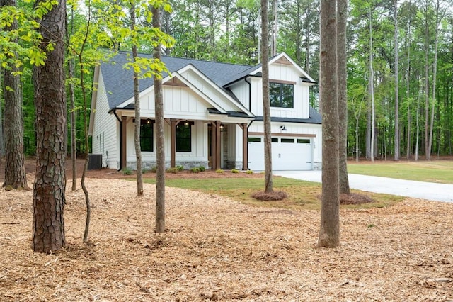 160 Doris Path, Dallas, GA 30157 - modern farmhouse with a garage, driveway, board and batten siding, a shingled roof, and a porch