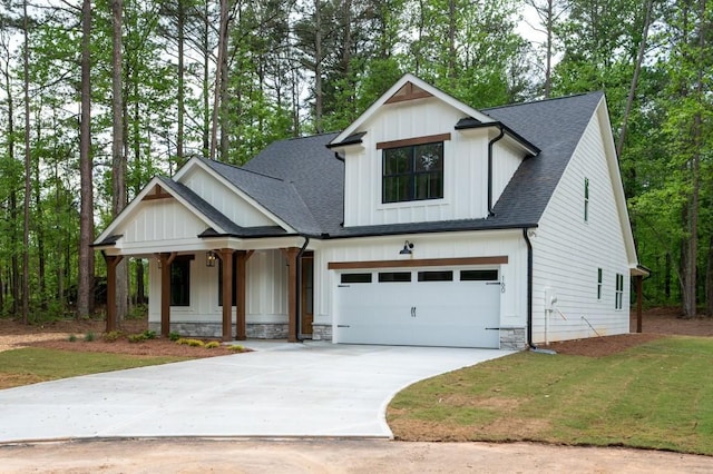 160 Doris Path, Dallas, GA 30157 - modern farmhouse style home featuring covered porch, board and batten siding, an attached garage, driveway, and roof with shingles