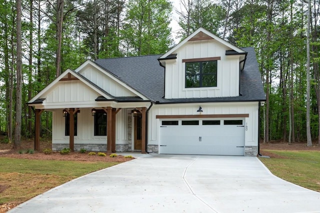 160 Doris Path, Dallas, GA 30157 - modern inspired farmhouse featuring roof with shingles, a porch, driveway, and board and batten siding
