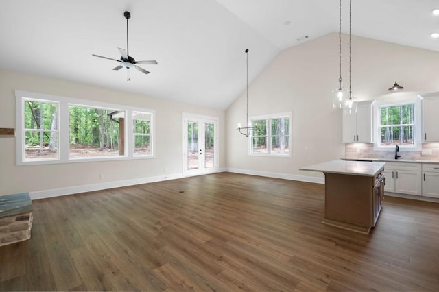 160 Doris Path, Dallas, GA 30157 - unfurnished living room with a sink, a ceiling fan, high vaulted ceiling, baseboards, and dark wood-style floors