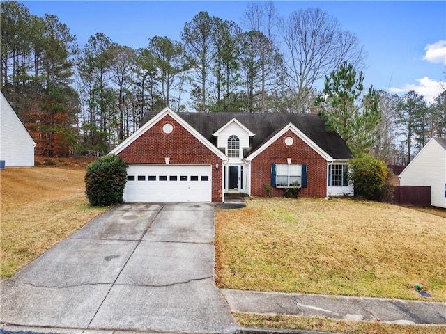 view of front of home featuring a front yard and a garage