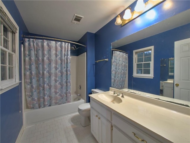 full bathroom with tile patterned flooring, vanity, toilet, and shower / tub combo