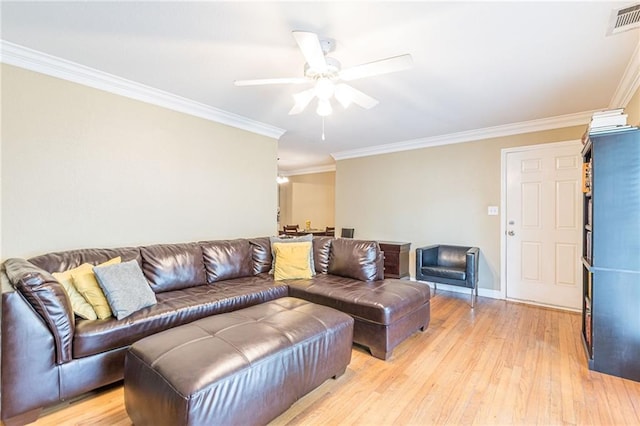 living room with ceiling fan, light hardwood / wood-style floors, and crown molding