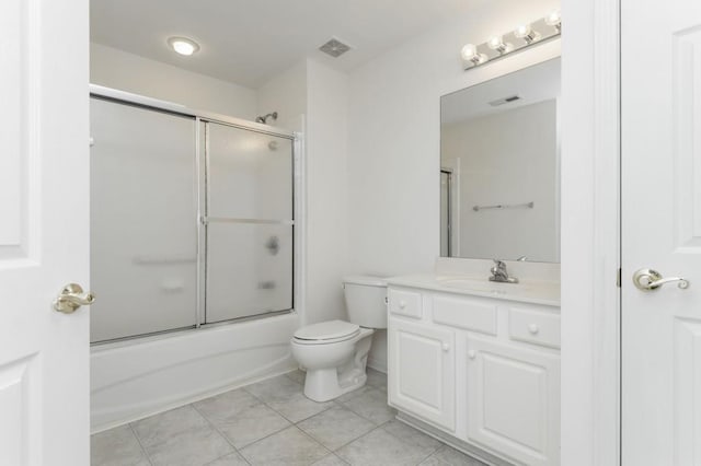 full bathroom with vanity, toilet, visible vents, and tile patterned flooring