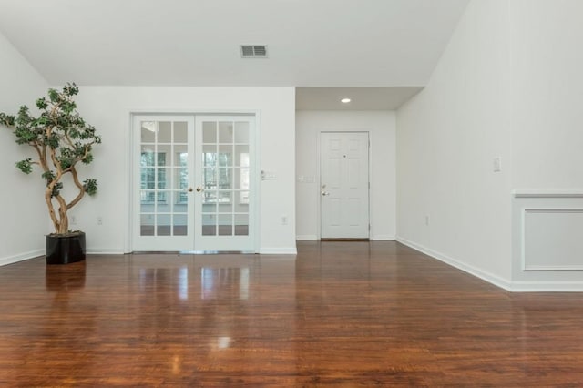 interior space with visible vents, baseboards, recessed lighting, french doors, and wood finished floors